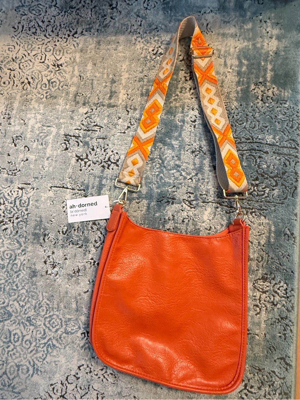 Orange Leather Crossbody Bag with Patterned Strap